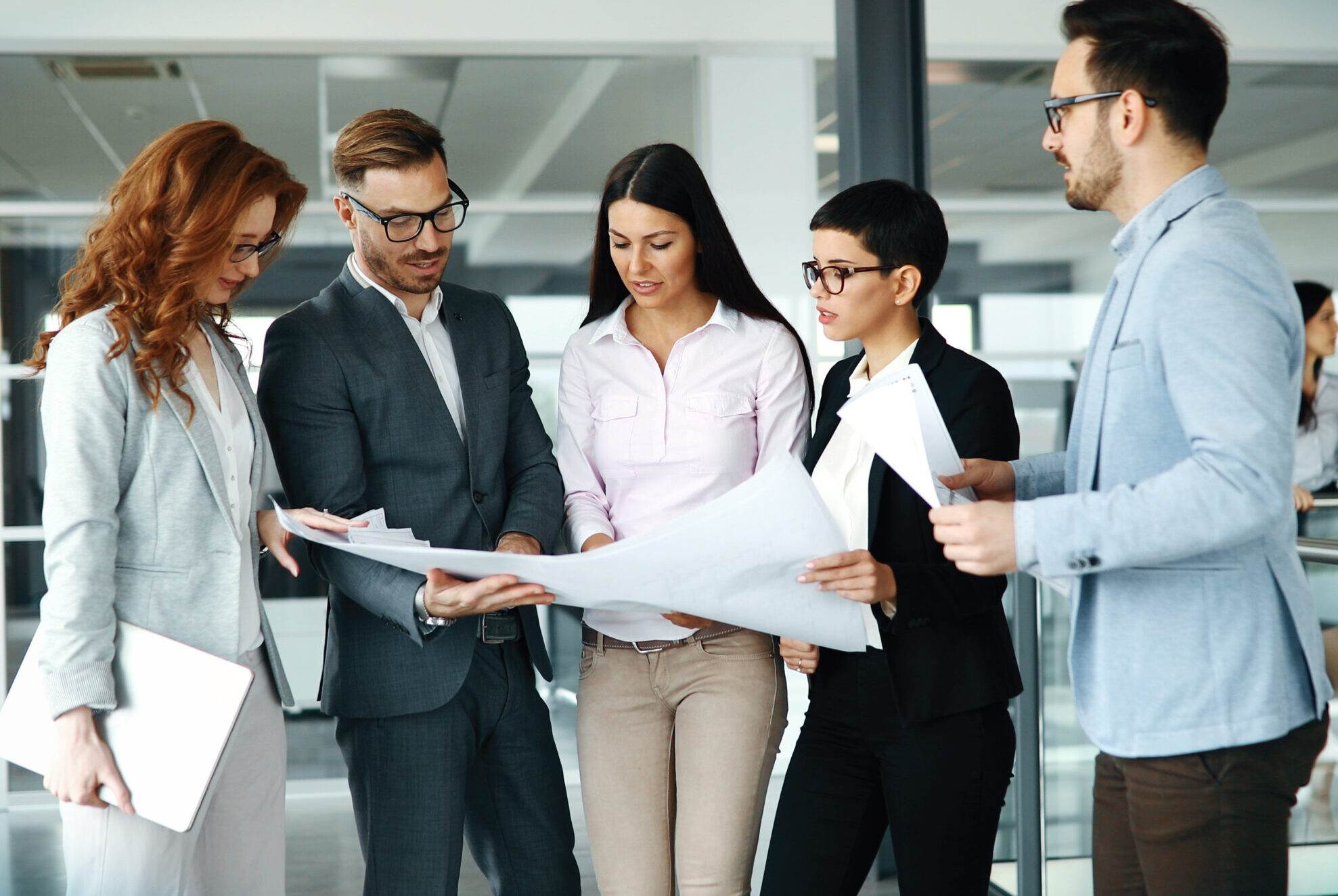 Corporate teamworking colleagues in modern office